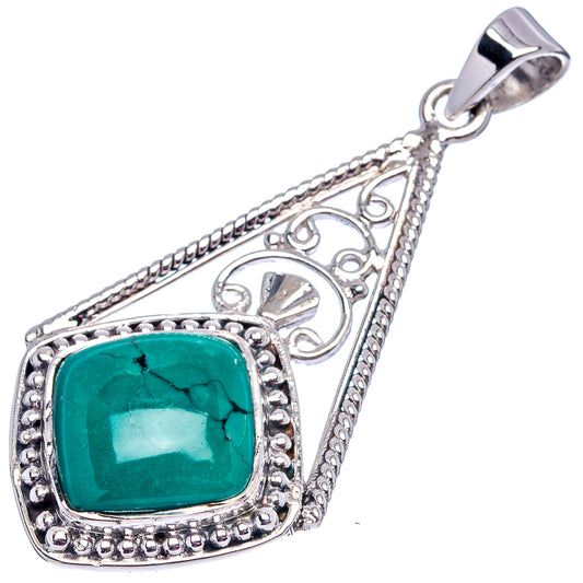Turquoise cabochon pendant with ornate .925 sterling silver frame and top loop