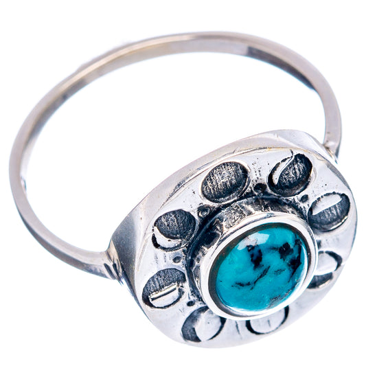 Turquoise cabochon dainty sterling silver ring with decorative setting, side view