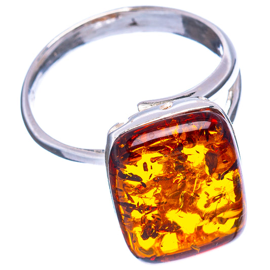 Silver adjustable ring with oval amber cabochon centerpiece and open top setting