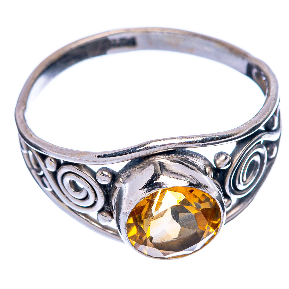 Sterling silver dainty ring with ornate band and oval faceted citrine gemstone on top