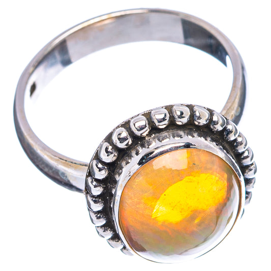 Sterling silver opal ring, round beaded halo and yellow-orange center, side view
