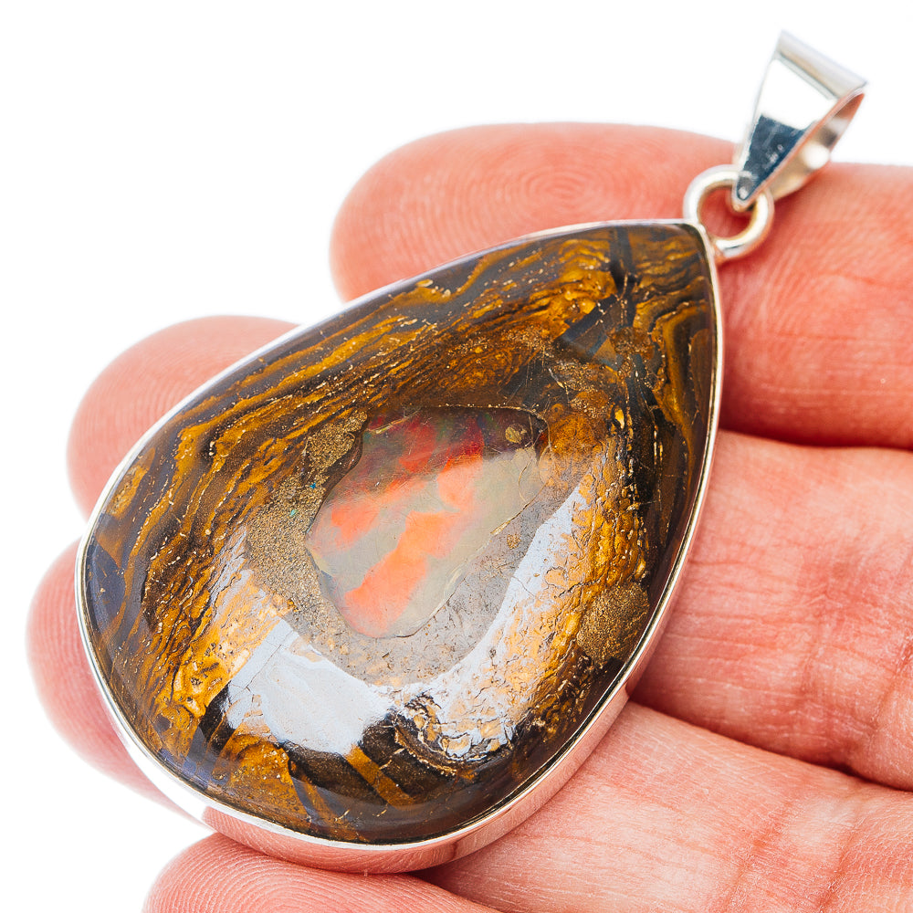 Teardrop boulder opal pendant in .925 sterling silver with brown-gold stone and silver loop