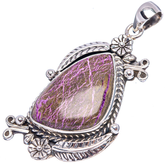 Sterling silver teardrop pendant with detailed border and purple cabochon