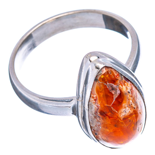 Sterling silver ring with orange fire opal oval setting, open angle on band.