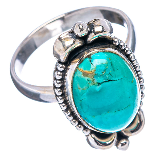 Turquoise oval cabochon ring in sterling silver, side view with bead bezel border