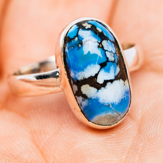 Sterling silver oval turquoise cabochon ring, side view on finger