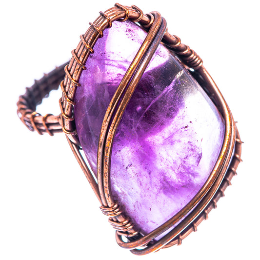 Oxidized copper wire-wrapped amethyst ring with oval purple stone, angled view