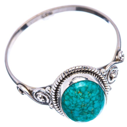 Sterling silver turquoise ring with round cabochon bezel and twisted split shank