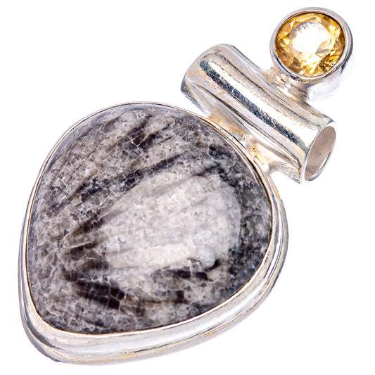Sterling silver pendant with oval gray stone and small round yellow gem top