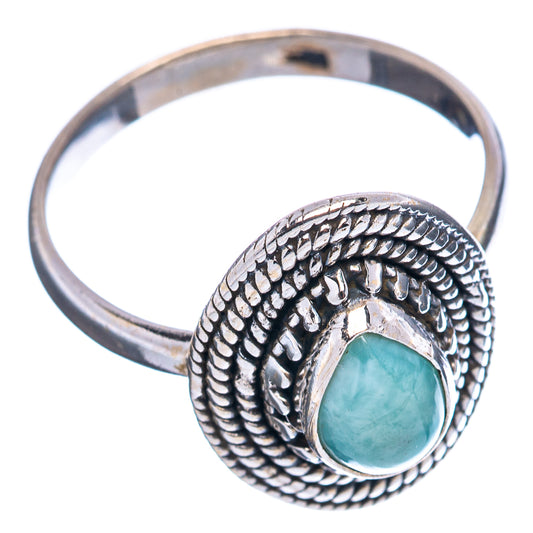 Silver ring with braided border band and teal oval gemstone, openwork side view