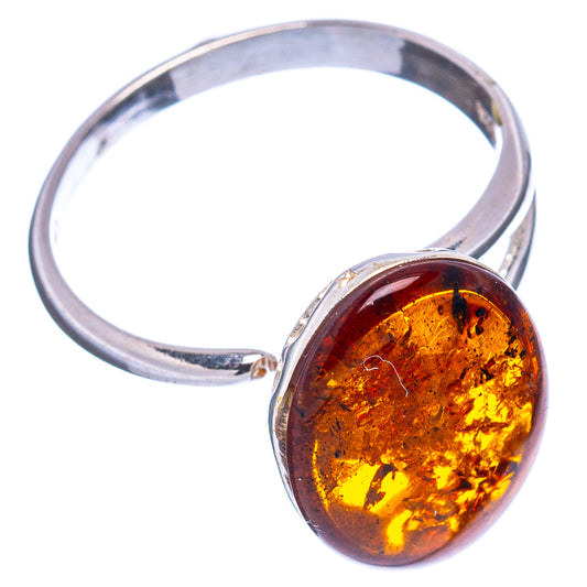 Oval amber cabochon set in .925 sterling silver adjustable ring, front angle