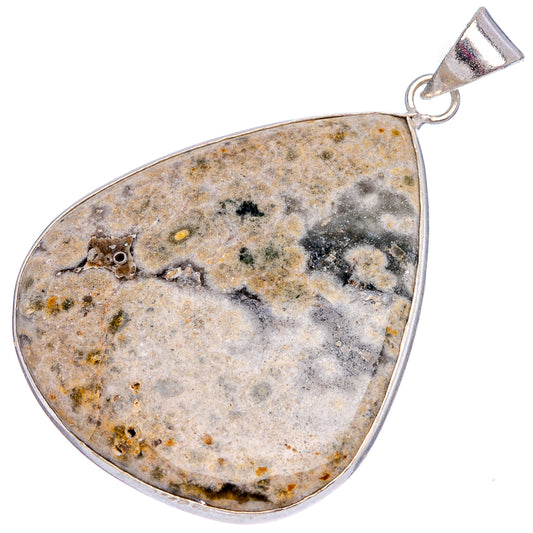 Speckled ocean jasper teardrop pendant in silver-plated frame and bail.