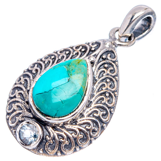 Sterling silver ornate teardrop pendant with turquoise cabochon and blue topaz, loop bail