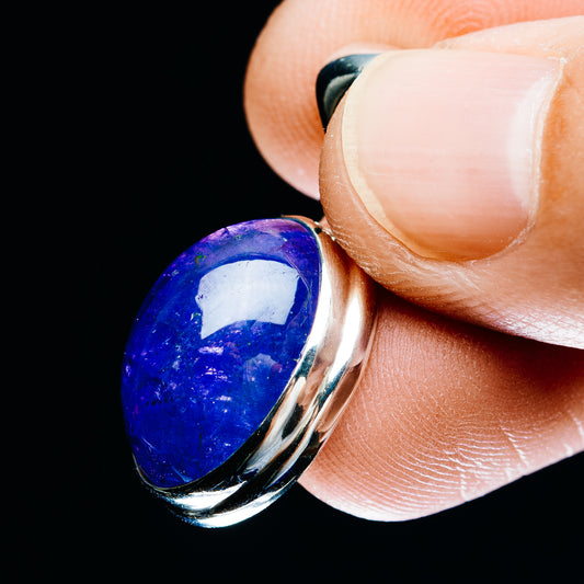 Close-up of oval tanzanite blue pendant in .925 sterling silver bezel with top bail