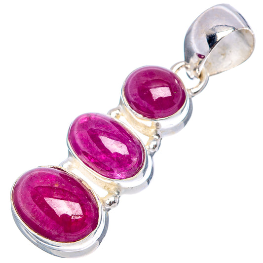 Three-stone ruby pendant with oval magenta stones and sterling silver bail