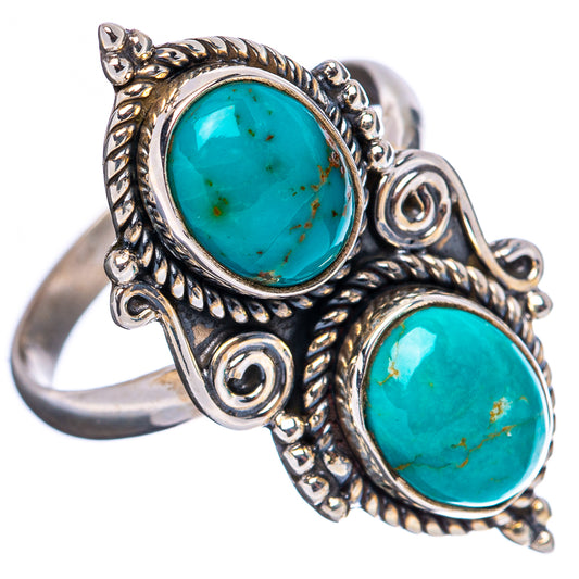 Adjustable sterling silver ring with two oval turquoise cabochons and swirled bezel detail