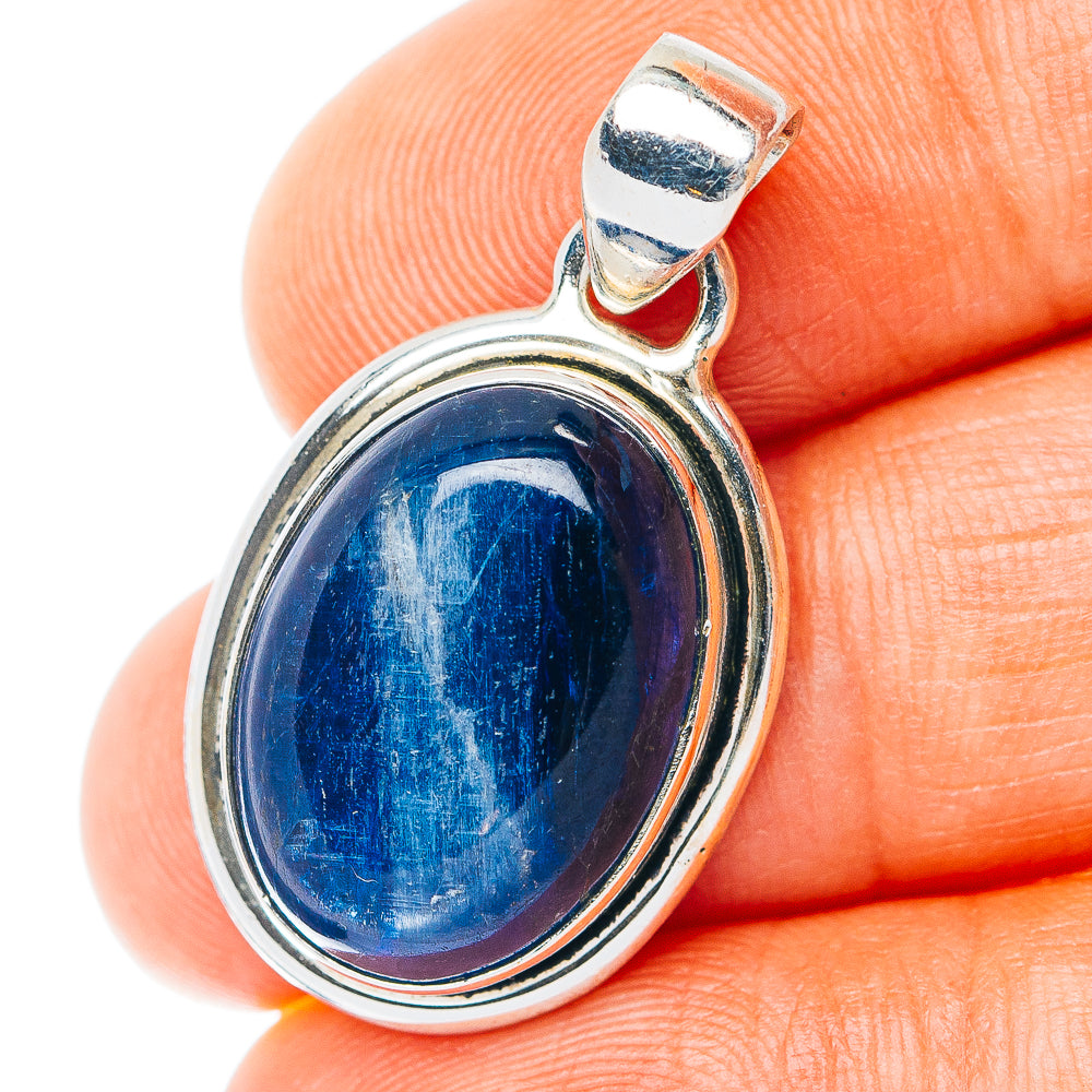 Oval kyanite pendant in .925 sterling silver with blue cabochon gemstone bezel