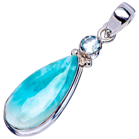 Blue gemstone teardrop pendant with sky-blue round stones in silver setting.