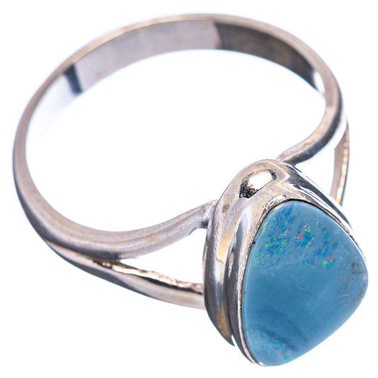 Sterling silver ring with oval blue opal doublet, sculpted prong-like band
