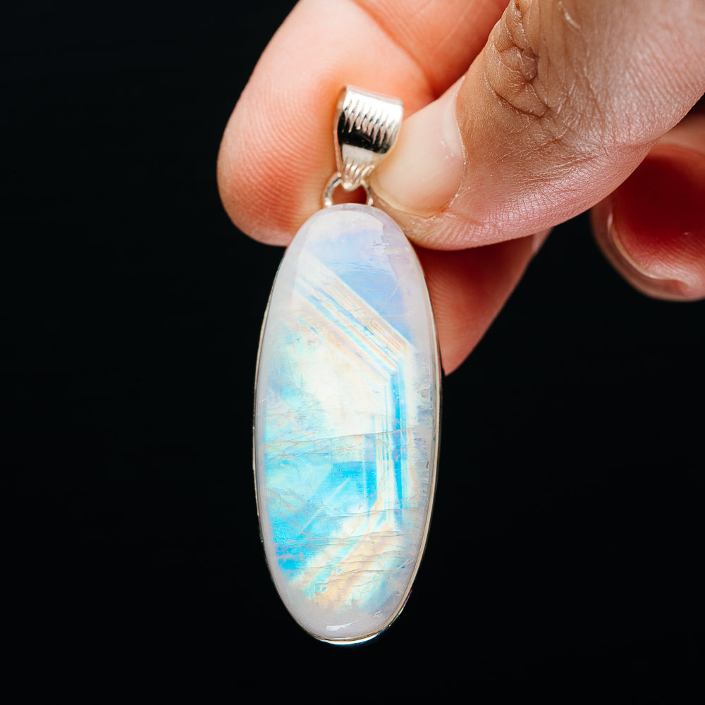 Rainbow moonstone teardrop pendant with silver bail in .925 sterling silver setting