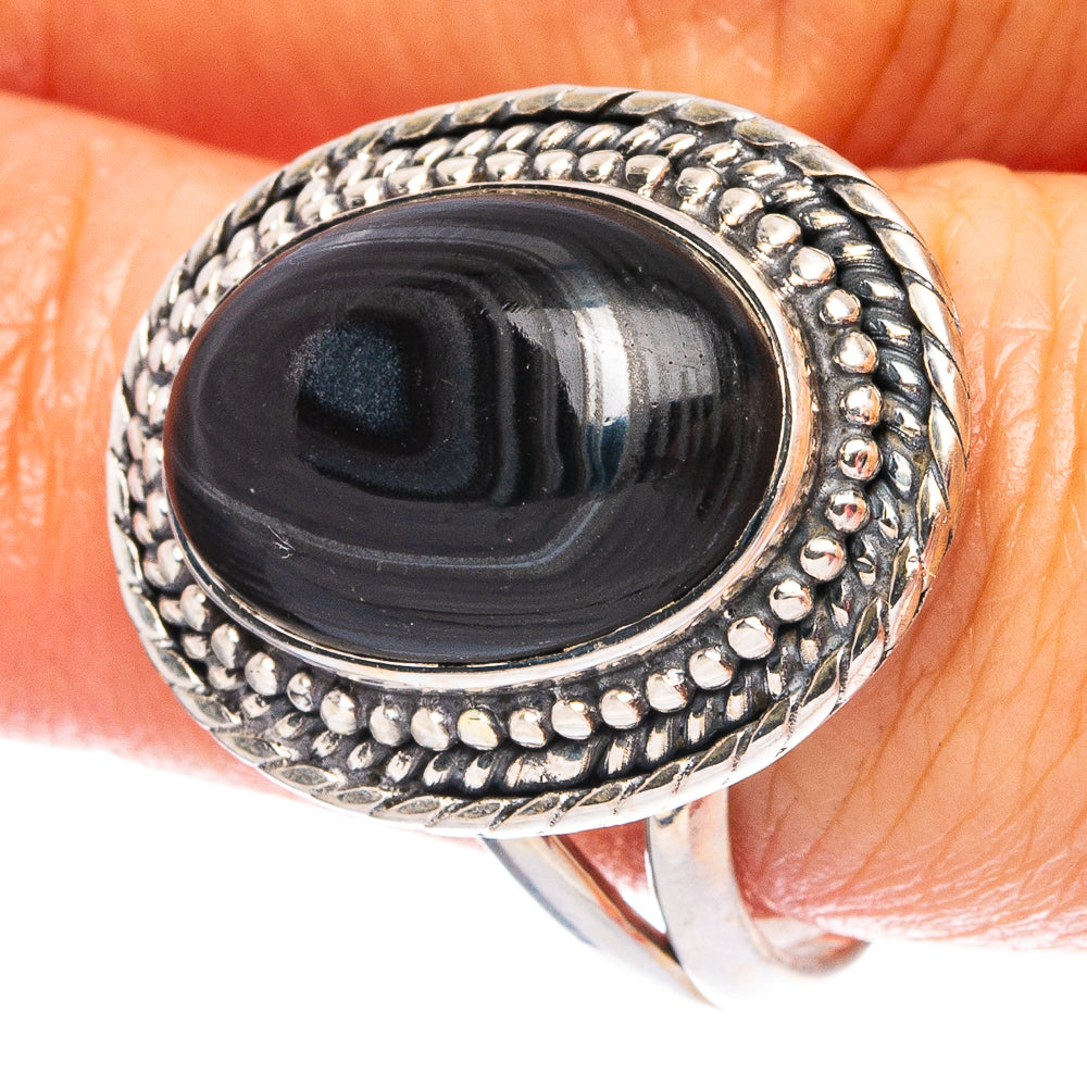 Sterling silver ring with oval black cabochon and beaded border