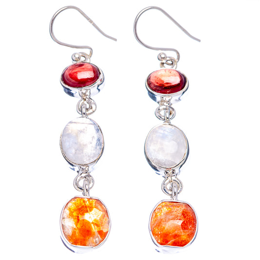 Pair of sterling silver drop earrings: red round cabochon, white oval, orange faceted beads