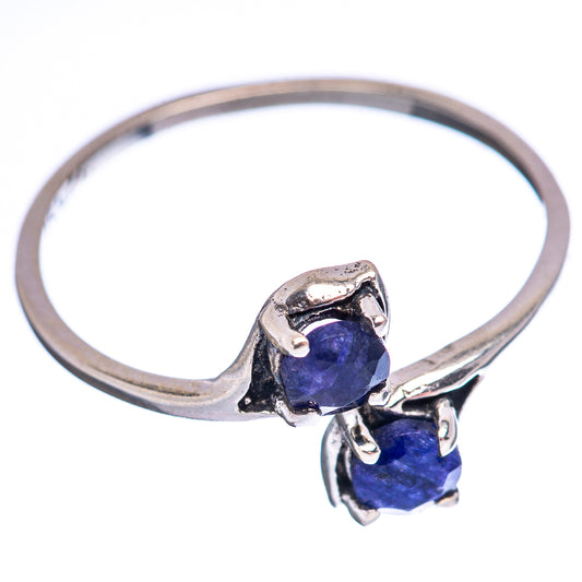 .925 sterling silver ring with two faceted deep-blue stones and prong accents