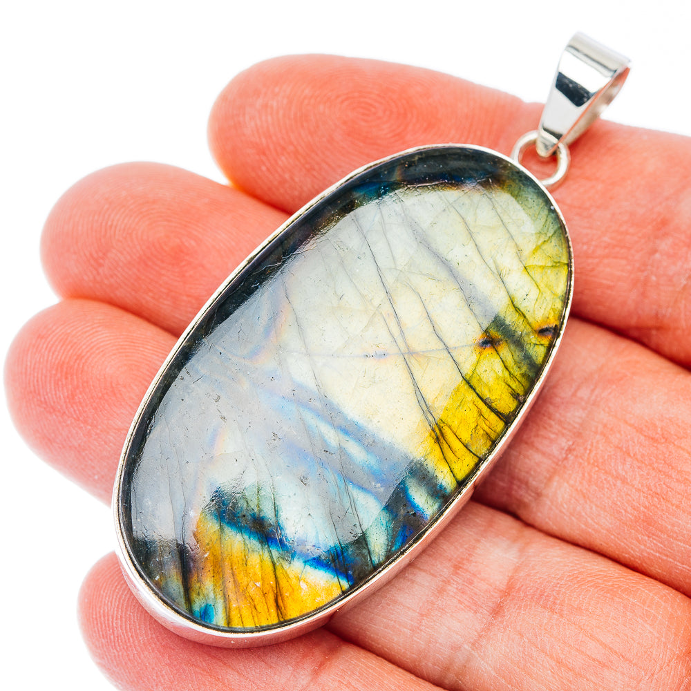Sterling silver pendant with teardrop spectrolite cabochon, multicolor blue green yellow