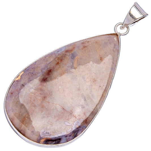 Silver-plated teardrop rhyolite pendant with stone and bail loop