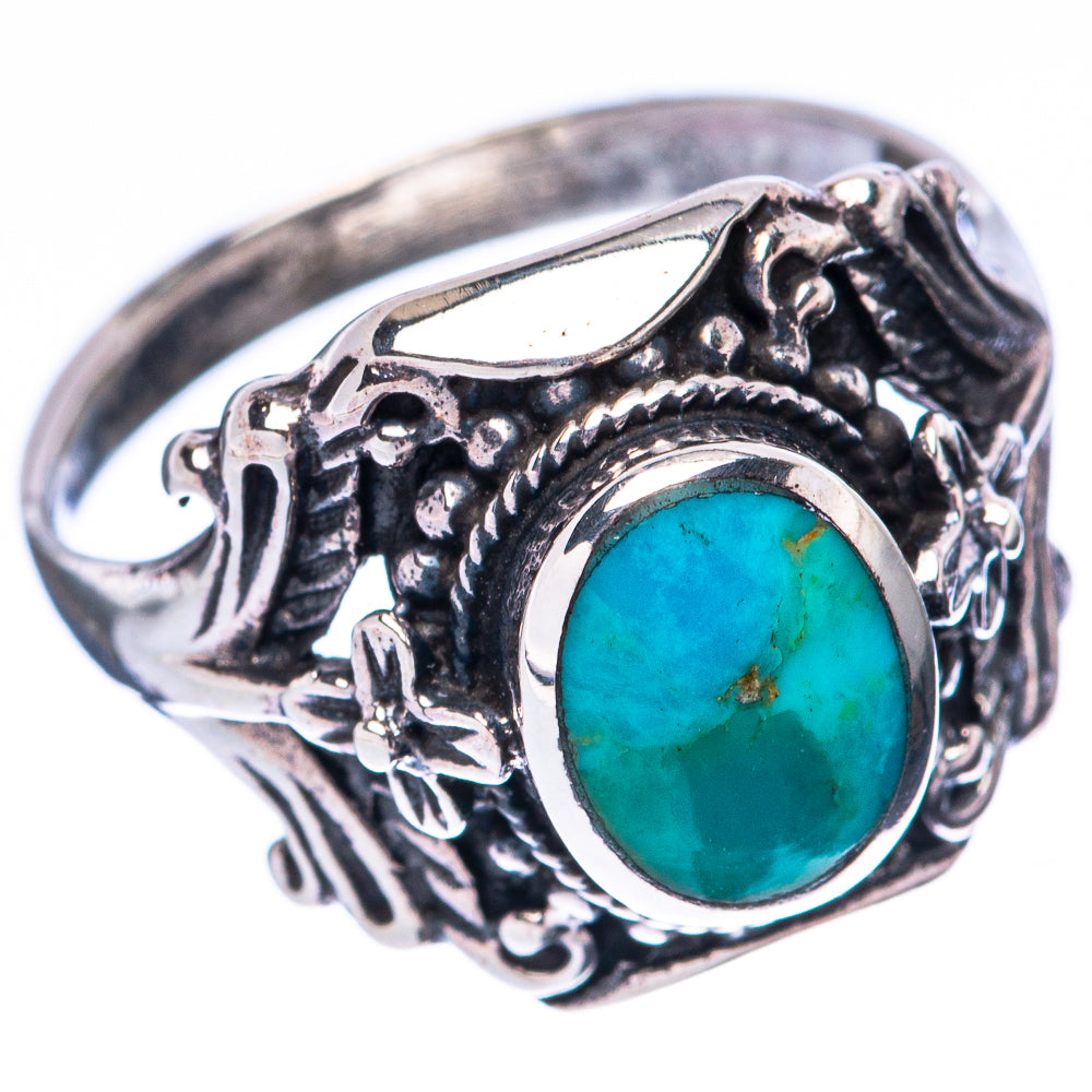 Sterling silver turquoise ring with oval blue cabochon, raised setting and scrollwork