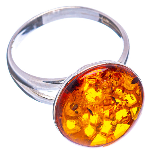 Sterling silver adjustable ring with round amber gemstone, showing band and face.