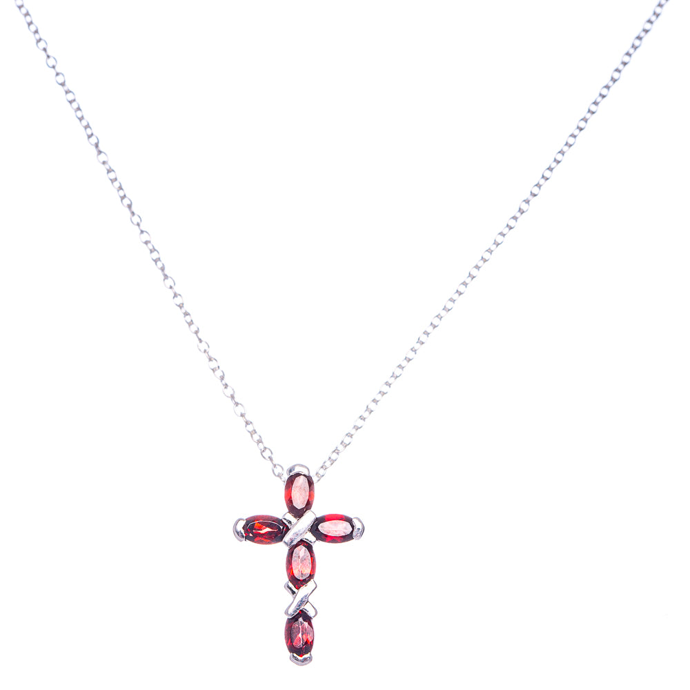 Cross pendant necklace with red garnet stones on a silver chain, 18-inch length