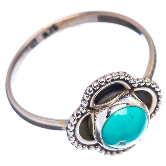 Sterling silver turquoise cabochon ring with beaded halo setting