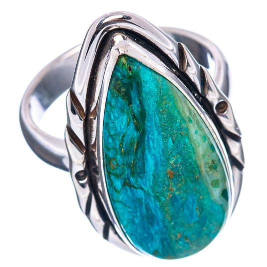 Sterling silver oval opal ring featuring a green-blue stone with carved gallery design