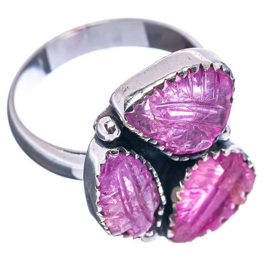 Sterling silver ruby ring with three faceted purple gemstones in a side view bezel setting
