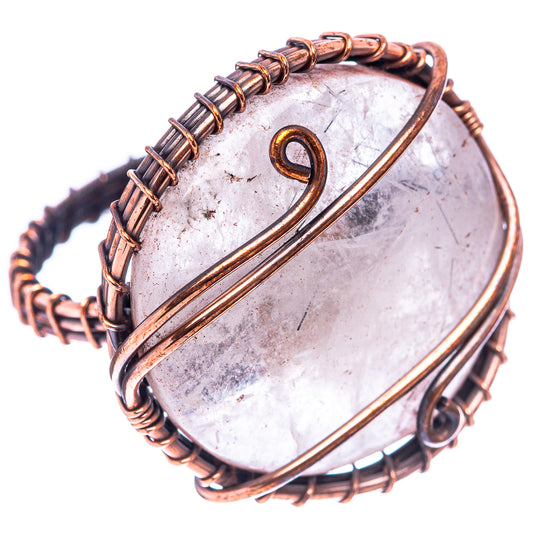 Oxidized copper wire ring with white quartz cabochon and spiral bezel detail