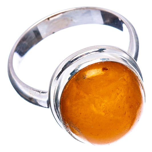 Round amber cabochon ring in .925 sterling silver band with honey-orange stone