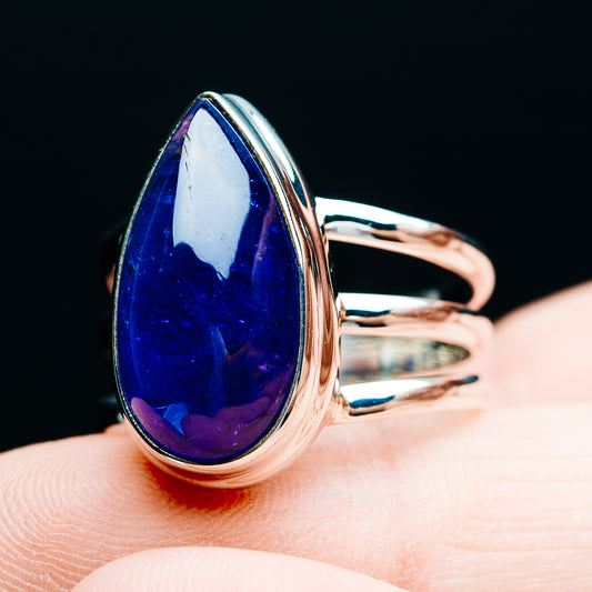 Blue teardrop gemstone ring on .925 sterling silver band, side view