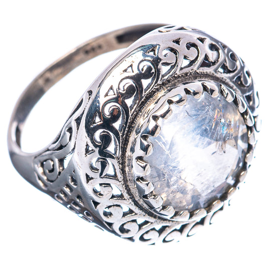 Sterling silver moonstone ring with oval iridescent stone in engraved filigree band