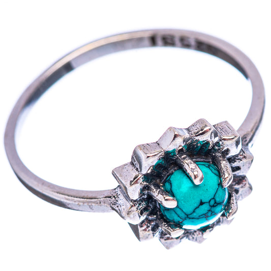 Sterling silver ring with turquoise oval stone and textured flower-like prongs