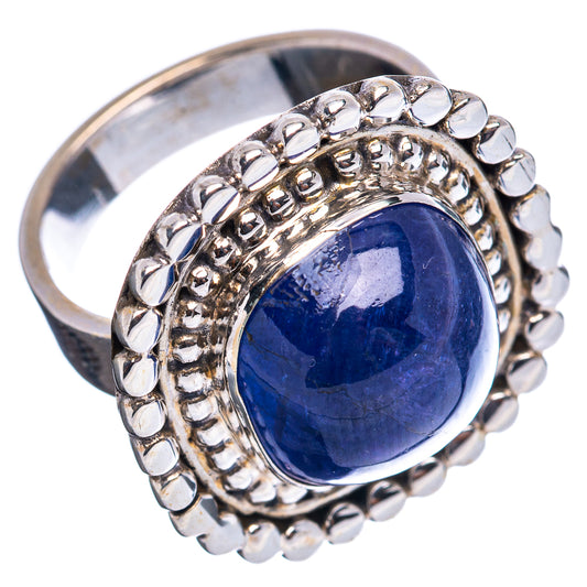 Sterling silver ring with oval blue gemstone bezel and raised round bead border
