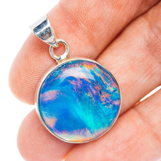 Round .925 sterling silver opal pendant with blue iridescent cabochon and bail