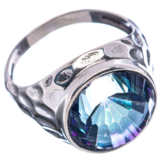Sterling silver ring with faceted blue gemstone and textured band