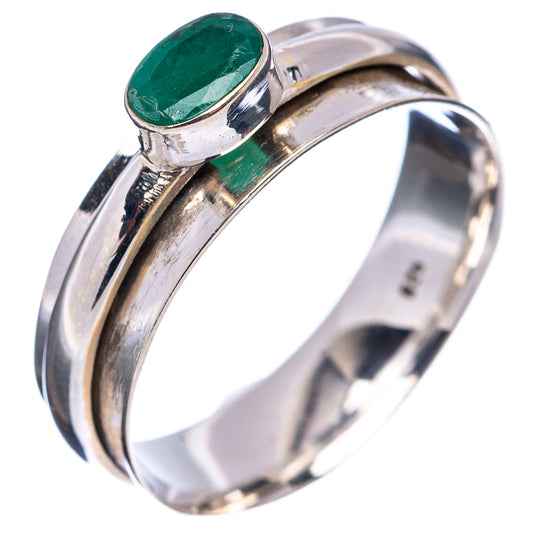Sterling silver spinner ring, side view of oval green cabochon set on cuff.
