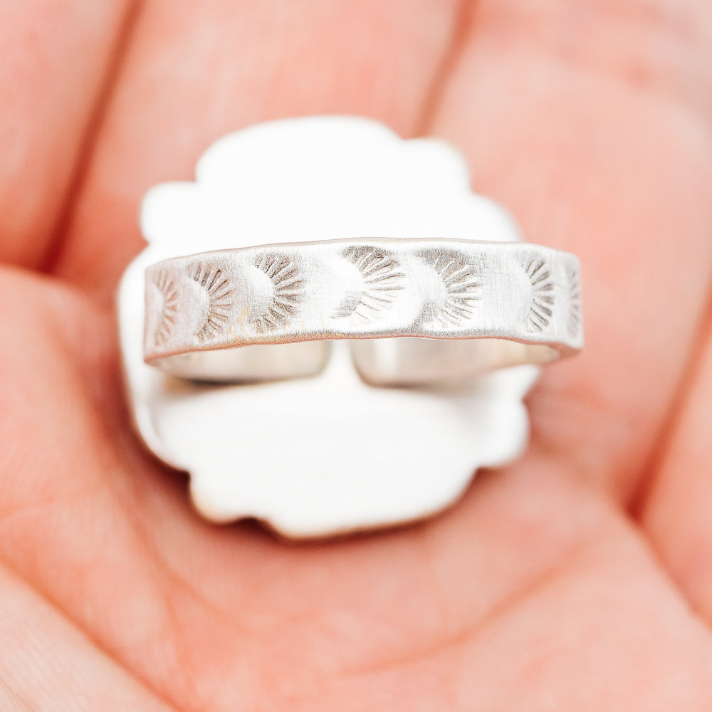 Sterling silver cross ring band with etched sunburst pattern on reverse