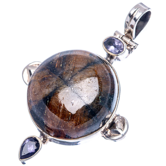 Sterling silver pendant with round brown-blue stone and two iolite teardrop drops