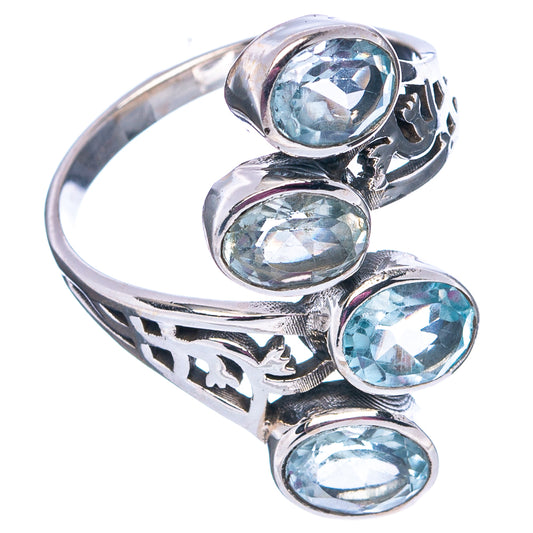 Sterling silver blue topaz ring with four oval stones and cutout metal band detail