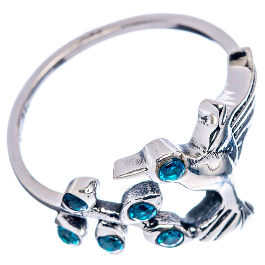 Sterling silver hummingbird ring with blue cubic zirconia stones along the band, size 7.75