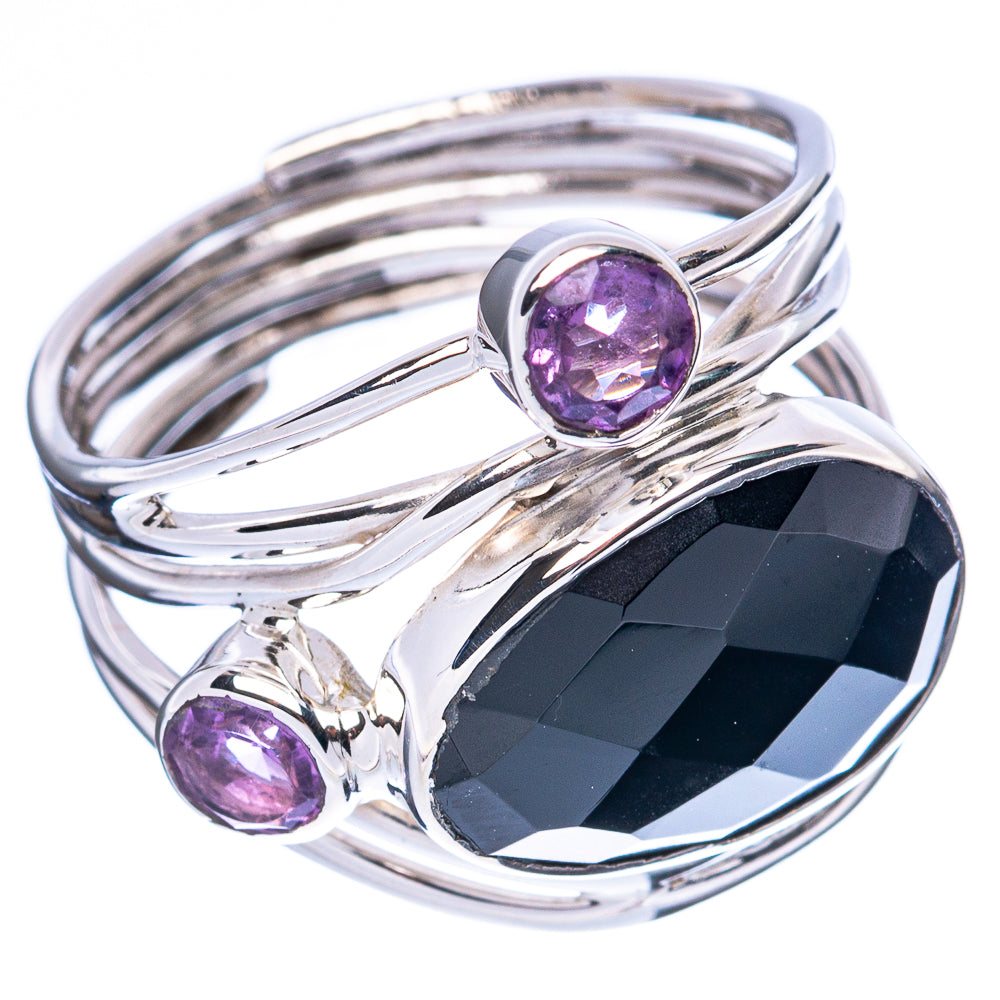 Sterling silver ring with black oval onyx, purple round stones, and sculpted split band