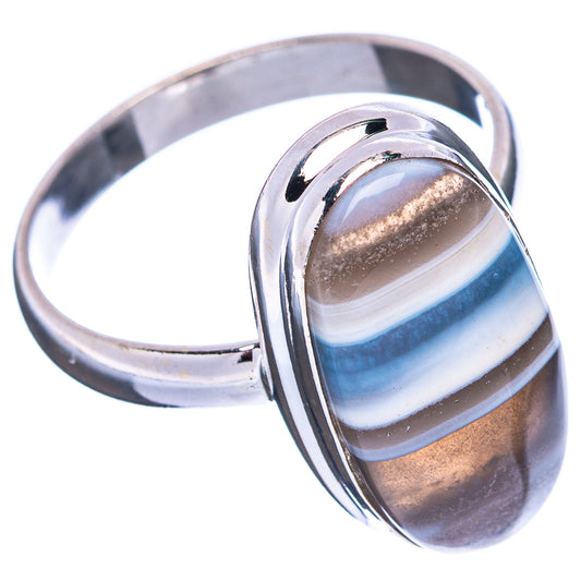 Sterling silver oval opal ring with raised bezel, striped blue and brown cabochon